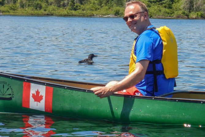 6 Hour Algonquin Park Canoe Trip - Canoe Lake start: paddling, reflections, and a totem you notice from afar