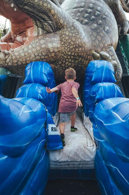 Montreal: Voiles En Voiles Aerial Park Admission Ticket - The ground-level fun: carousel, climbing wall, and inflatable games