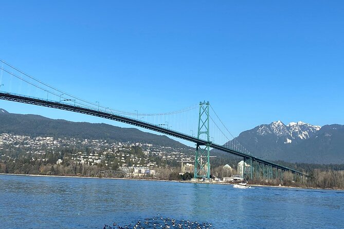 Private Guided Grand City Tour in Vancouver with your luggage - English Bay and Denman Street: sand time plus a classic downtown coastline