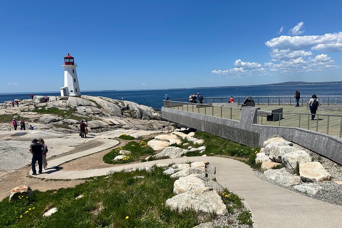 Private Guided Tour: Peggy’s Cove, Mahone Bay, Lunenburg & Ovens - Peggy’s Cove Lighthouse: granite rocks, legends, and memorials