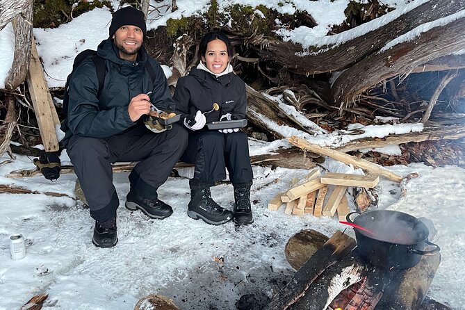 Snowshoeing with mountain goats Private activity - The campfire lunch by the river: Quebec stew, maple whisky, and legends