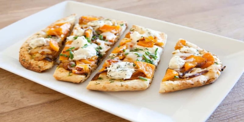 Vancouver: Granville Island Small Group Food Walking Tour - Croissant and mini pizza, the first flavor hits