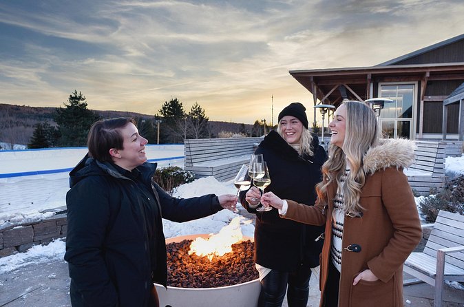 Winter Wine Escape - Benjamin Bridge on the heated terrace with holiday lights in winter